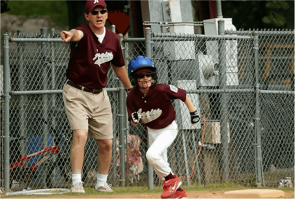 Man coaching Baseball to a kid